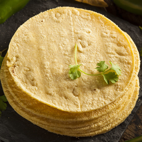 Corn tortillas are a round, thin, unleavened bread made with coarse masa flour or “flourless” fresh masa.
