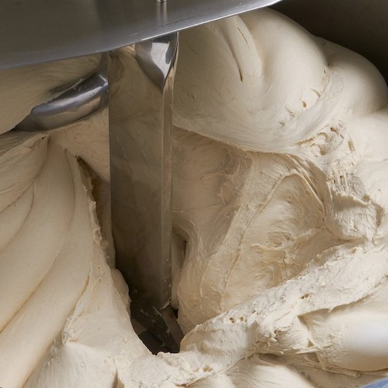 The goal of dough mixing is to mechanically create a humongous dough.