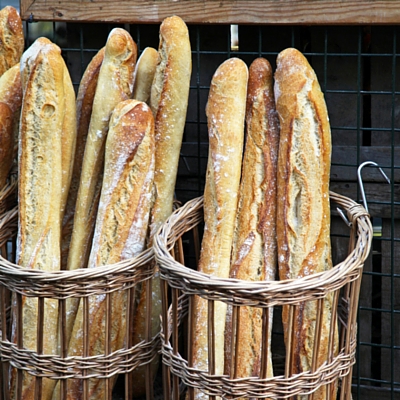 A baguette is characterized by a crisp crust and chewy texture inside.