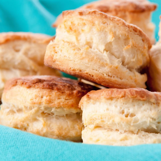 American biscuits are small quick bread rounds that can be either cakey and dense, or flaky and light.