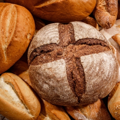 Scoring bread gives a variety of patterns on the top crust and helps with development.