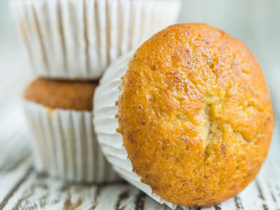 Nothing can beat a warm, moist banana nut muffin especially when in need of an extra energy boost! Perfect for a grab-and-go breakfast, these tiny yet powerful energy boosters will add ease to the hectic morning. (Or serve as the ideal pre-workout snack!) Formulated with a lower fat content, this recipe includes bananas, yogurt, wholesome whole-wheat, and flax. The ultimate combination for one mean muffin jam-packed with a nutritious punch! Definitely not a run-of-the-mill empty, calorie obliterating muffin. Enjoy - without an ounce of guilt!